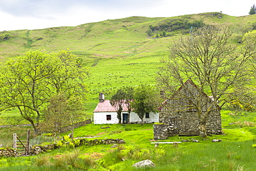 Quaint cottage dwelling and old stone barn at Auchindrain, Highland farming township settlement and village folklore museum at Furnace near Inveraray in the Highlands, Scotland, United Kingdom, Europe