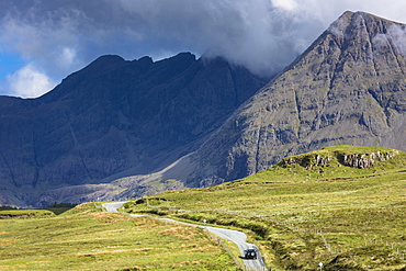 Four wheel drive vehicle on road in Cuillin mountain range, Isle of Skye, Highlands and Islands, Scotland, United Kingdom, Europe