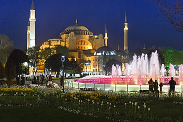 Floodlit domes and minarets of Hagia Sophia mosque museum, UNESCO World Heritage Site, Atmeydani Hippodrome fountain in Istanbul, Turkey, Europe