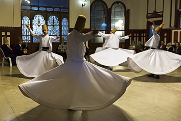 Tourists at Whirling Dervish ayin music performance (Mevlevi Sema) a spiritual ceremony performed by whirling dervishes, Istanbul, Turkey, Eurasia