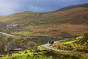 Truck driving through the Brecon Beacons for logging timber production, Powys, Wales, United Kingdom, Europe