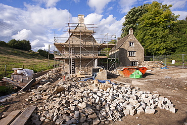 Home improvement, a renovation project restoring a 17th century Cotswold old stone cottage in Swinbrook in the Cotswolds, Oxfordshire, England, United Kingdom, Europe