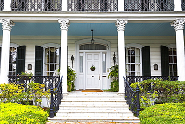 Traditional double gallery grand mansion house with columns and porch in the Garden District of New Orleans, Louisiana, USA