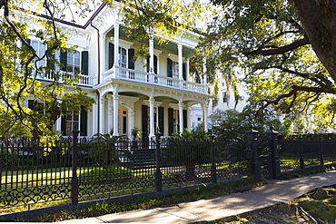 Neo-classical clapboard grand house with double gallery and columns in the Garden District, New Orleans, USA