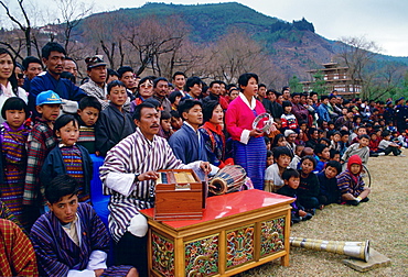 Musicians and spectators at dance and archery festival, Paro, Bhutan