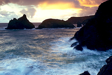 Waves crashing over the rocks at Kynance Cove in Cornwall, South West England.