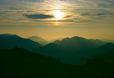 The sun setting over theSalzkammergut mountain range, Austria