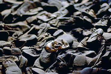 Majdanek Concentration Camp - a child's shoe lies among shoes discarded from Jewish victims of the Holocaust, Poland.