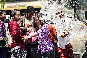 Locals celebrate Thai New Year by throwing water at one another, Songkran water festival, Chiang Mai, Thailand, Southeast Asia, Asia