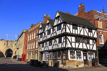 Half-timbered Leigh-Pemberton House, red phone box and Lincoln Castle, Castle Square, Lincoln, Lincolnshire, England, United Kingdom, Europe