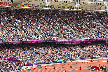 Crowds in the stands of Olympic Stadium, with runners on the starting blocks, London 2012, Summer Olympic Games, London, England, United Kingdom, Europe