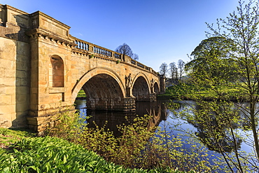 Sandstone bridge by Paine over River Derwent on a spring morning, Chatsworth Estate, home of Duke of Devonshire, Derbyshire, England, United Kingdom, Europe