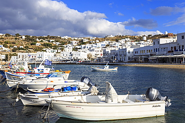 Small boats in harbour, whitewashed Mykonos Town (Chora) with windmills on hillside, Mykonos, Cyclades, Greek Islands, Greece, Europe