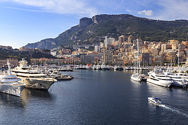 Pastel hues of the glamorous harbour of Monaco (Port Hercules) with many yachts, viewed from the sea, Monte Carlo, Monaco, Cote d'Azur, Mediterranean, Europe