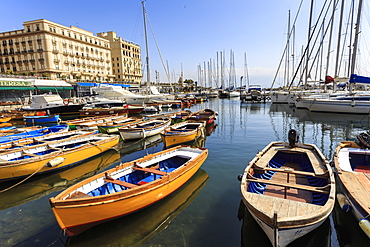 Yachts and colourful rowing boats in the marina Borgo Marinaro, Vesuvius in distance, Chiaia, City of Naples, Campania, Italy, Europe