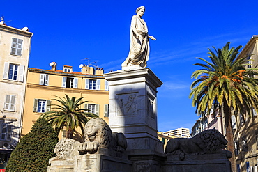 Statue of Napoleon as Roman Emperor, with lions and palm trees, pastel buildings, Place Foch, Ajaccio, Island of Corsica, France, Europe