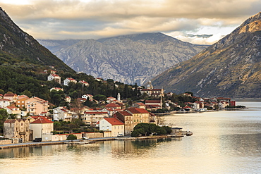 Town on the shores of the stunningly beautiful Bay of Kotor (Boka Kotorska) at sunset, UNESCO World Heritage Site, Montenegro, Europe