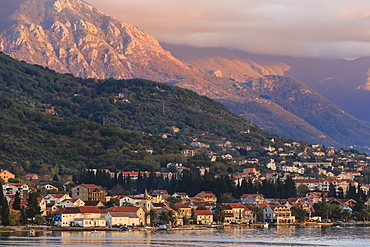 Town at sunset on the stunningly beautiful Bay of Kotor (Boka Kotorska) at sunset, UNESCO World Heritage Site, Montenegro, Europe