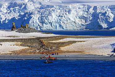 Expedition tourists leave Half Moon Island, Livingston Island blue glaciers and evening sun, South Shetland Islands, Antarctica, Polar Regions