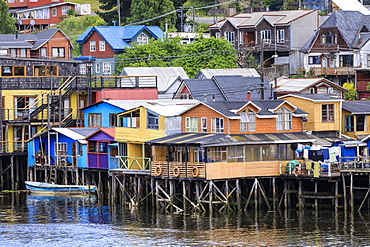 Palafitos, colourful stilt houses on water's edge, elevated view, unique to Chiloe, Castro, Isla Grande de Chiloe, Chile, South America