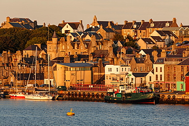 Lerwick, from the sea, waterfront sandstone buildings and golden early morning, Shetland Islands, Scotland, United Kingdom, Europe