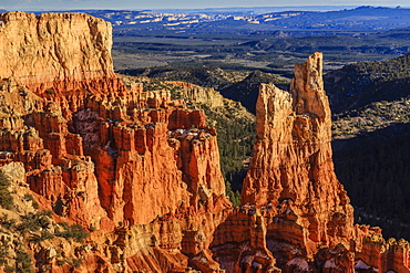 Hoodoos lit by late afternoon sun with distant view in winter, Paria View, Bryce Canyon National Park, Utah, United States of America, North America