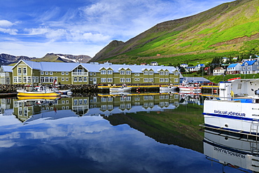 Harbour, hotel and fishing boats, mountains, reflections, Siglufjordur, (Siglufjorour), stunning Summer weather, North Iceland, Europe