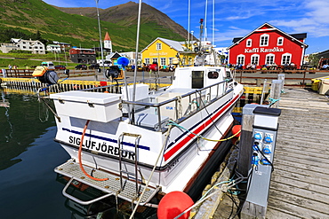 Church, busy cafes, fishing boat and mountains, Siglufjordur, (Siglufjorour), stunning Summer weather, North Iceland, Europe, Europe