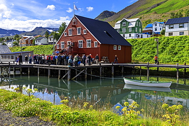 Tourists at the busy, award-winning Herring Era Museum, Siglufjordur, (Siglufjorour), stunning Summer day, North Iceland, Europe