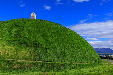 Thufa, green mound, blue sky, little house or fish drying shed in summer, Mount Esja, Old Harbour, Reykjavik, Iceland, Polar Regions