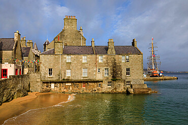 Beautiful waters of Bain's Beach, smugglers cove, historic buildings, Central Lerwick, Shetland Isles, Scotland, United Kingdom, Europe