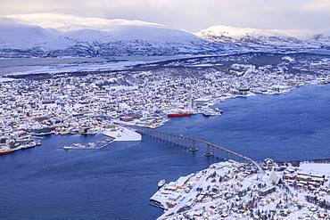 Tromso, Tromsoya and fjord, after heavy snow, elevated view from Mount Storsteinen in winter, Tromso, Troms, Arctic North Norway, Scandinavia, Europe