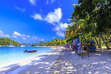 Saltwhistle Bay, white sand beach, turquoise sea, colourful boat, yachts, palm trees, Mayreau, Grenadines, St. Vincent and The Grenadines, Windward Islands, West Indies, Caribbean, Central America