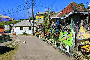 Quiet Caribbean, colourful buildings, sleeping dog, main street, village, Mayreau, Grenadines, St. Vincent and The Grenadines, Windward Islands, West Indies, Caribbean, Central America