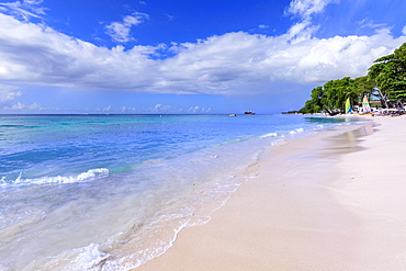 Paynes Bay, small colourful sail boats pulled up on fine pale pink sand beach, beautiful West Coast, Barbados, Windward Islands, West Indies, Caribbean, Central America