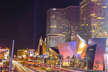 Neon lights, Las Vegas Strip South at night with cars leaving light streaks in front of City Center, Las Vegas, Nevada, United States of America, North America 