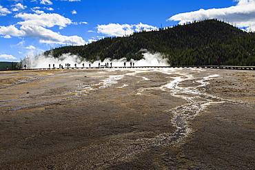 Tourists on boardwalk in silhouette, Grand Prismatic Spring, Midway Geyser Basin, Yellowstone National Park, UNESCO World Heritage Site, Wyoming, United States of America, North America