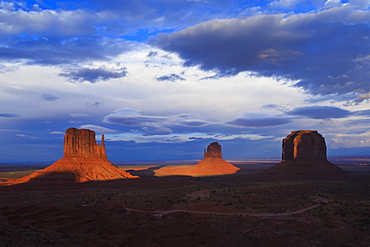 The Mittens at dusk cast long shadows, Monument Valley Navajo Tribal Park, Utah and Arizona border, United States of America, North America 