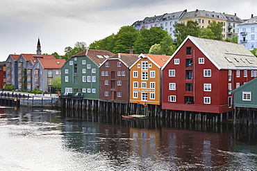 Colourful wooden warehouses on wharf beside the Nidelva River, Bakklandet neighbourhood, Trondheim, Sor-Trondelag, Norway, Scandinavia, Europe