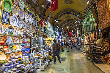 Shops and sellers (vendors) selling Turkish pottery, carpets, kilims, Grand Bazaar, Istanbul, Turkey, Europe