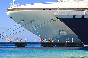 Cruise ships and disembarking passengers, with snorkeler in azure sea, cruise terminal, Grand Turk, Turks and Caicos, West Indies, Caribbean, Central America