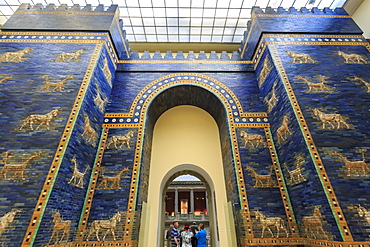 Visitors with audio guides pass through Ishtar Gate (Babylon), Pergamonmuseum (Pergamon Museum), Museum Island, Berlin, Germany, Europe