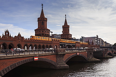 Busy Oberbaumbrucke, double-decker bridge linking two Berlin districts, Kreuzberg and Friedrichshain, over River Spree, Berlin, Germany, Europe