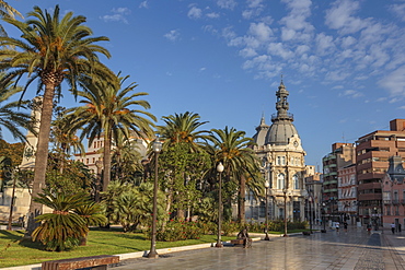 Town Hall under a cloud dappled blue sky with palm trees and roses, Cartagena, Murcia Region, Spain, Europe