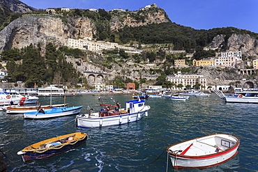 Fishing boats in Amalfi harbour, cliffs and hills, Costiera Amalfitana (Amalfi Coast), UNESCO World Heritage Site, Campania, Italy, Europe