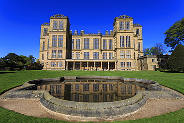 Hardwick Hall, near Chesterfield, reflected in pond under a clear blue sky, Derbyshire, England, United Kingdom, Europe