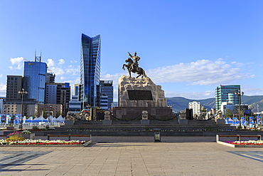 Statue of Sukhbaatar on horse, with new development behind, blue sky, Chinggis Khaan Square, Ulaanbaatar (Ulan Bator), Mongolia, Central Asia, Asia