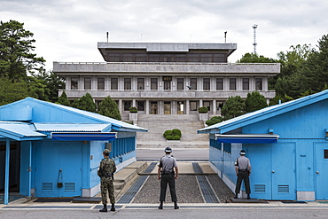 ROK soldiers and blue UN buildings face North Korea, Panmunjom, Joint Security Area (JSA), North and South Korea border, Asia