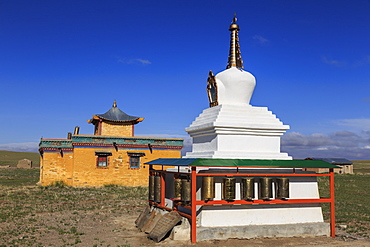 Colourful small temple and vibrant stupa in countryside under blue sky in summer, Dundgov, North Gobi, Mongolia, Central Asia, Asia