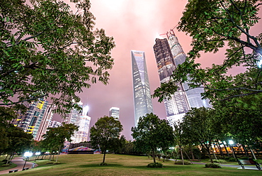 Lujiazui Central Park with Jin Mao Tower, Shanghai World Financial Center and Shanghai Tower under construction, at night, Shanghai, China, Asia 